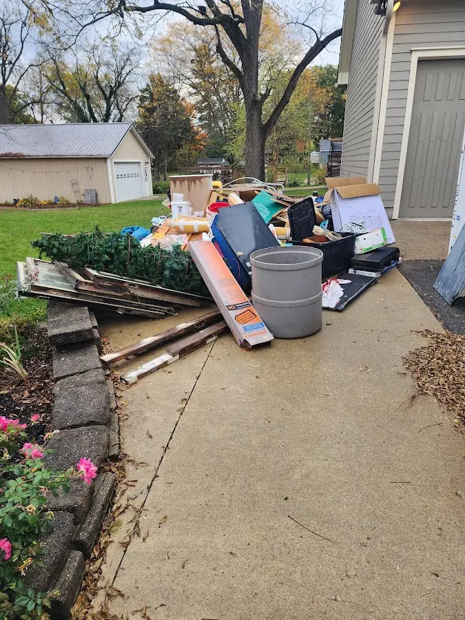 Dumpster being loaded with debris for 30 Yard Dumpster Rental in Rockdale